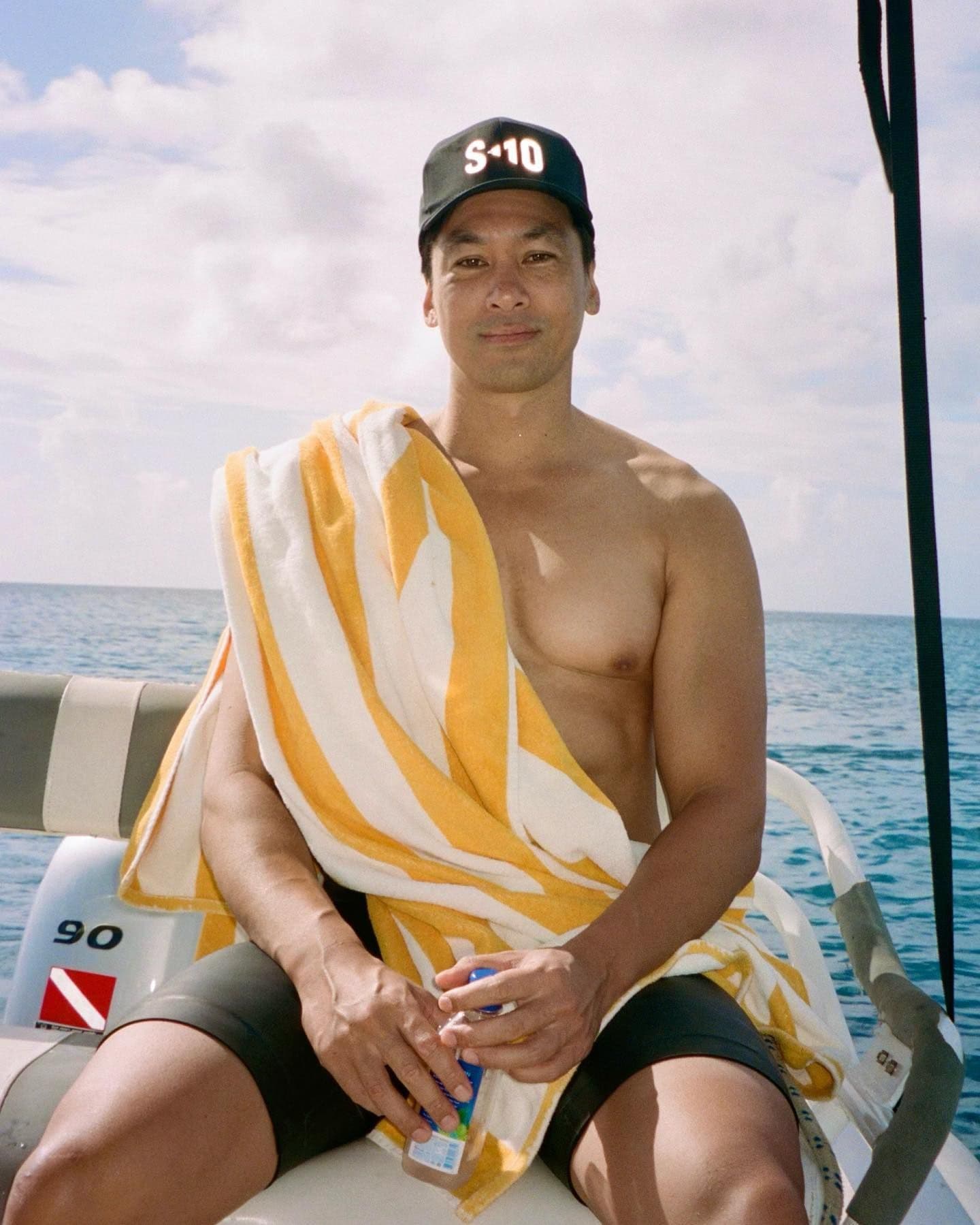Stephen Cheuk, founder of S10 Training, wearing an S10 cap after an athletic swim